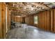 Unfinished basement featuring exposed wood framing, a window, and a concrete floor at 19 Four Feathers Ne Ln, Rydal, GA 30171