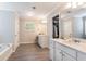 Stylish bathroom with double vanities, modern fixtures, a soaking tub, and a separate water closet at 19 Four Feathers Ne Ln, Rydal, GA 30171
