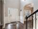 Inviting foyer with white wainscoting, wood floors, and lots of natural light at 19 Four Feathers Ne Ln, Rydal, GA 30171