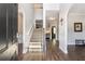 Bright foyer with stairs and beautiful wood flooring to provide a welcoming atmosphere at 19 Four Feathers Ne Ln, Rydal, GA 30171