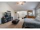 Bright main bedroom featuring a vaulted ceiling, plush carpet, and a convenient entertainment center at 19 Four Feathers Ne Ln, Rydal, GA 30171
