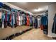 Extensive walk-in closet with ample hanging space and shoe storage at 19 Four Feathers Ne Ln, Rydal, GA 30171