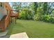Large, level backyard with a wooden deck and stairs, perfect for outdoor activities at 2793 Horse Shoe Dr, Atlanta, GA 30316