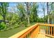 View of lush backyard from wooden deck with railing, overlooking expansive green space at 2793 Horse Shoe Dr, Atlanta, GA 30316