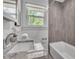 Nicely finished bathroom features a granite vanity and tiled tub/shower at 2793 Horse Shoe Dr, Atlanta, GA 30316