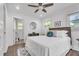 Bedroom featuring hardwood floors, natural light, and an attached bathroom at 2793 Horse Shoe Dr, Atlanta, GA 30316