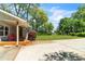 View of the driveway and front porch featuring a red chair at 2793 Horse Shoe Dr, Atlanta, GA 30316