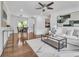Spacious living area showcasing hardwood floors, stylish decor, and an adjacent dining space at 2793 Horse Shoe Dr, Atlanta, GA 30316