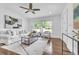 Bright living room featuring hardwood floors, neutral furniture, and a large window with natural light at 2793 Horse Shoe Dr, Atlanta, GA 30316
