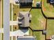 Aerial view of a home with a well-maintained backyard featuring lush green grass and privacy fencing at 4689 Shire Dr, Lithonia, GA 30038