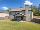 Spacious backyard with a covered patio, perfect for outdoor entertaining and relaxation at 4689 Shire Dr, Lithonia, GA 30038