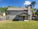 Spacious backyard with a covered patio, perfect for outdoor entertaining and relaxation at 4689 Shire Dr, Lithonia, GA 30038