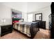 Bedroom showcases wood furniture, neutral carpet, and city-themed art at 4689 Shire Dr, Lithonia, GA 30038