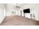 Expansive bonus room featuring vaulted ceilings, carpet, and ample space at 4689 Shire Dr, Lithonia, GA 30038