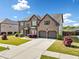 Charming two-story brick home with a well-manicured lawn and a two-car garage at 4689 Shire Dr, Lithonia, GA 30038