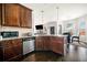 Gourmet kitchen with granite countertops, stainless steel appliances, and hardwood floors overlooking dining area at 4689 Shire Dr, Lithonia, GA 30038