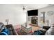 Comfortable living room with fireplace, large-screen TV, and cozy seating at 4689 Shire Dr, Lithonia, GA 30038