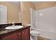 Clean bathroom with granite counters, modern fixtures, and a shower-tub combo for convenience at 1544 English Manor Cir, Stone Mountain, GA 30087