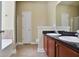 Bathroom featuring double sinks with granite countertop and tiled floor at 1544 English Manor Cir, Stone Mountain, GA 30087