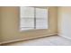 Bedroom featuring a window, carpet, and neutral walls at 1544 English Manor Cir, Stone Mountain, GA 30087