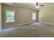 Bedroom featuring natural light, carpet flooring, and a tray ceiling at 1544 English Manor Cir, Stone Mountain, GA 30087
