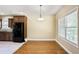 Cozy dining area with hardwood floors, a chandelier, and natural light from the windows at 1544 English Manor Cir, Stone Mountain, GA 30087