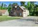 Beautiful two-story brick home featuring an attached garage, driveway, and well-maintained lawn at 1544 English Manor Cir, Stone Mountain, GA 30087