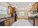 Stylish kitchen featuring granite countertops, tile flooring, and modern appliances at 1544 English Manor Cir, Stone Mountain, GA 30087