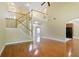 Bright and open living room with hardwood floors, staircase, and access to the kitchen at 1544 English Manor Cir, Stone Mountain, GA 30087