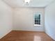 Minimalist bedroom showcasing wood floors, ample natural light, and a serene ambiance at 1704 Golf Link Dr, Stone Mountain, GA 30088