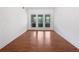 This living room has hardwood floors and three large windows at 1704 Golf Link Dr, Stone Mountain, GA 30088