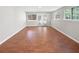 Comfortable living room with hardwood floors, natural light and doors to outside at 1704 Golf Link Dr, Stone Mountain, GA 30088