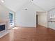 Bright open-concept living room with high ceilings and wood floors, fireplace at 1704 Golf Link Dr, Stone Mountain, GA 30088