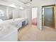 Bright main bathroom with double vanity, tiled floors and a glass-enclosed shower at 1704 Golf Link Dr, Stone Mountain, GA 30088