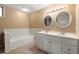 Bathroom featuring a shower-tub combination and large vanity with double sinks at 3923 Lookout Point Dr, Marietta, GA 30066