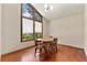 Cozy dining area with wood table and chairs, bathed in natural light from the large window at 3923 Lookout Point Dr, Marietta, GA 30066