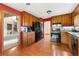 Well-equipped kitchen featuring wood cabinets, black appliances, and views into the living areas at 3923 Lookout Point Dr, Marietta, GA 30066