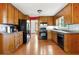 Functional kitchen with wood cabinets, black appliances, and linoleum flooring at 3923 Lookout Point Dr, Marietta, GA 30066