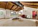 Bright living room with vaulted wood ceilings, comfortable seating, and views of the lush surroundings at 3923 Lookout Point Dr, Marietta, GA 30066