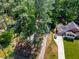 Aerial view of a home with a long driveway and lush green lawn at 404 Bridlewood Cir, Decatur, GA 30030