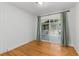 Bright bedroom with hardwood floors, white walls, and sliding glass doors leading to deck at 404 Bridlewood Cir, Decatur, GA 30030