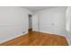 Clean bedroom with hardwood floors, white trim, closet and natural light from window at 404 Bridlewood Cir, Decatur, GA 30030