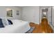 Bright bedroom featuring hardwood floors, white walls, and a large window for ample natural light at 404 Bridlewood Cir, Decatur, GA 30030