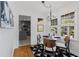 Charming dining room with modern decor, natural light, and a view of the updated kitchen at 404 Bridlewood Cir, Decatur, GA 30030