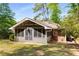 View of screened-in porch addition with brick and siding exterior, perfect for outdoor enjoyment at 404 Bridlewood Cir, Decatur, GA 30030