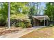 Charming single-story brick home with a covered carport and mature landscaping at 404 Bridlewood Cir, Decatur, GA 30030