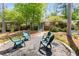 Charming home with landscaped front yard, inviting seating area and mature trees at 404 Bridlewood Cir, Decatur, GA 30030