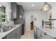Charming kitchen with gray cabinets, stone countertops, stainless steel appliances and large sink at 404 Bridlewood Cir, Decatur, GA 30030