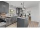 Modern gray kitchen with stainless steel appliances, granite countertops, and ample cabinet space at 404 Bridlewood Cir, Decatur, GA 30030