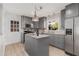 Updated kitchen featuring gray cabinets, granite countertops, stainless steel appliances, and an island at 404 Bridlewood Cir, Decatur, GA 30030